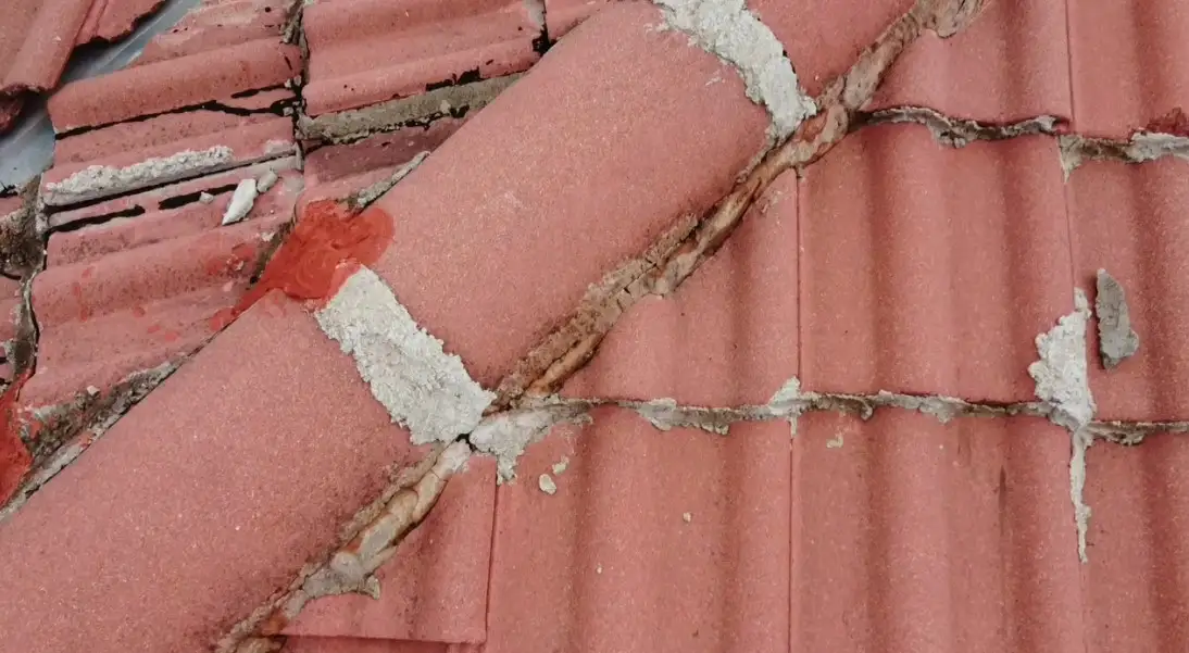 Close up 4K drone shot of damaged double roman tiles